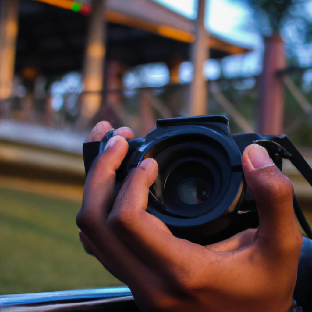 Person holding camera, capturing scenes